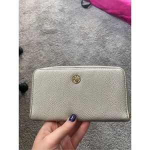 AA silver clutch with gold zipper